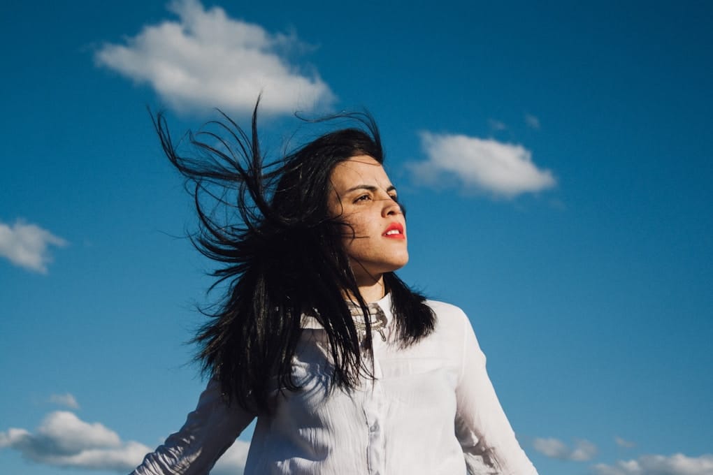 woman wearing white button-up cardigan